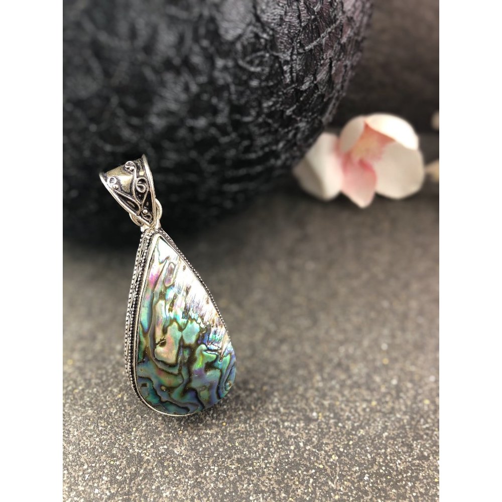 Artisan Abalone Shell Pendant with detailed silver tone bale